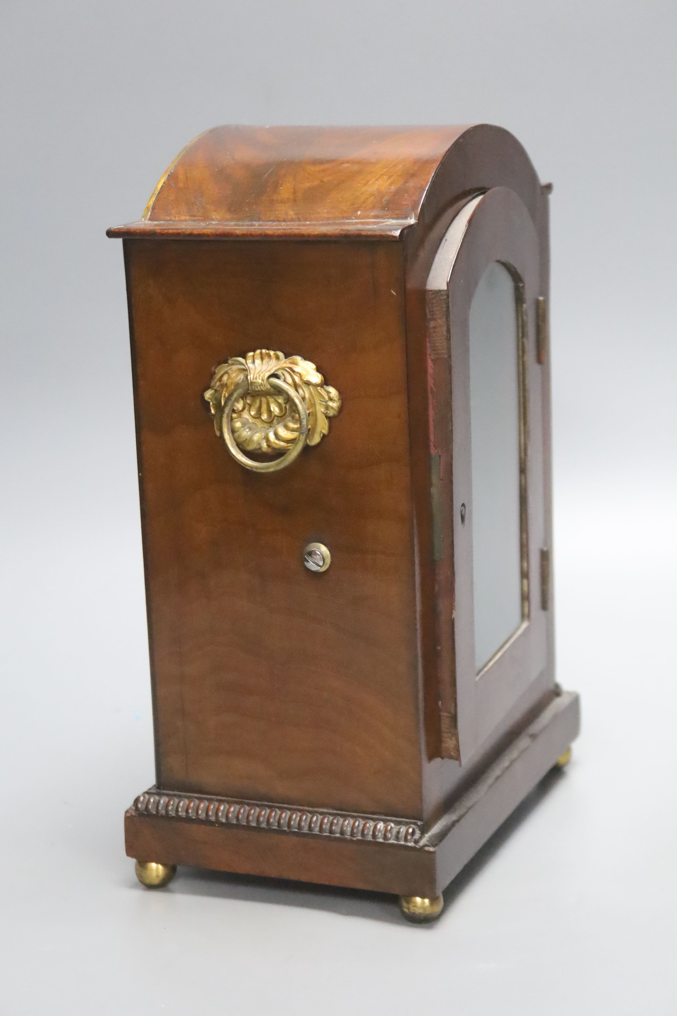 A George IV brass inlaid mahogany mantel clock, with keys and pendulum, height 28cm